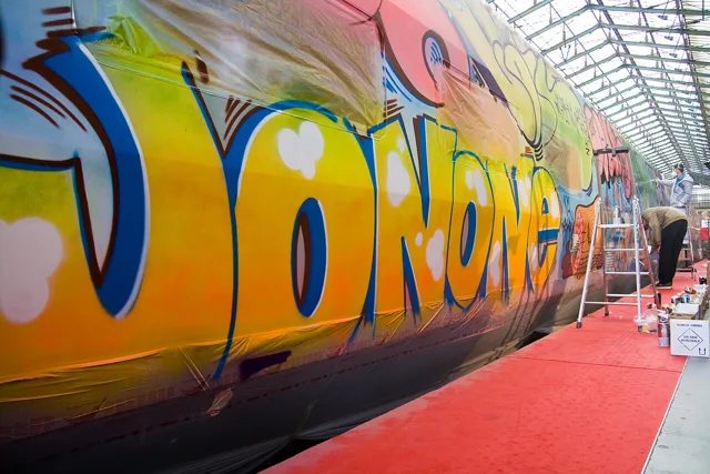 JonOne’s large yellow lettering on a Thalys train