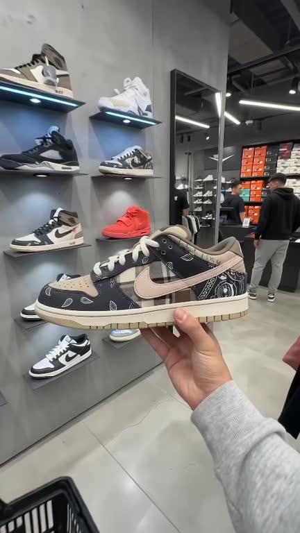 The shopper continues through the sneaker store with their selected trainer