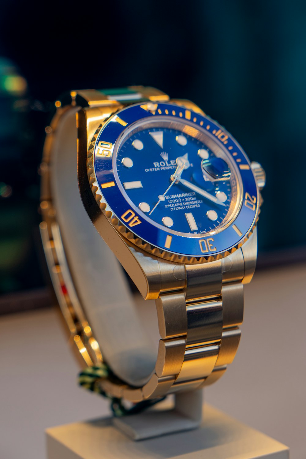 Blue and gold Rolex watch on display