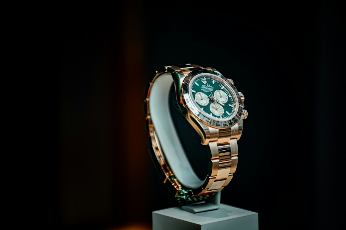 Gold watch with green dial