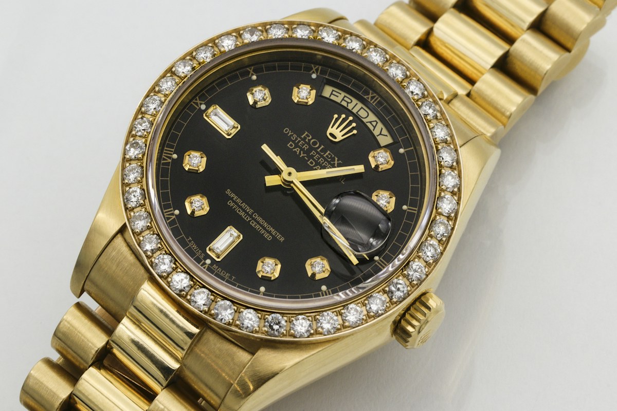 Gold Rolex watch with diamond detail